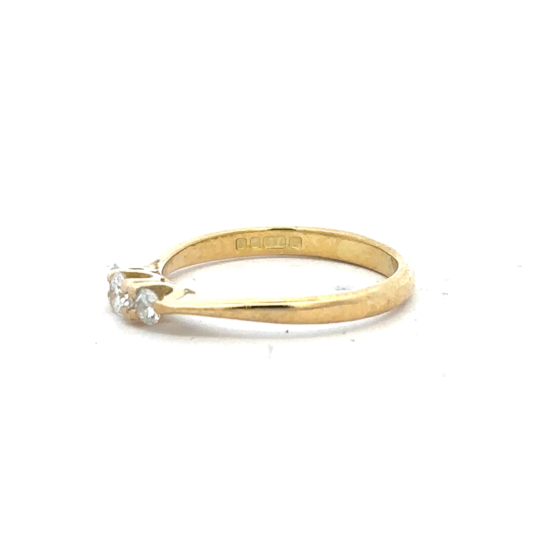 18ct yellow gold diamond ring in size L, featuring a sparkling diamond centerpiece and a sleek polished band.