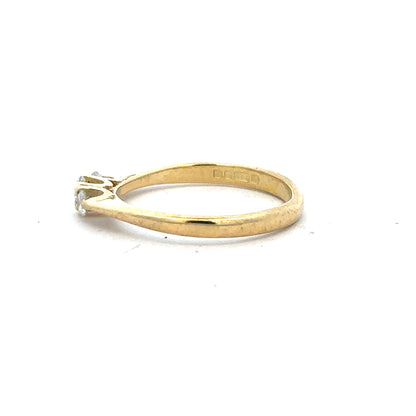 18ct yellow gold diamond ring in size L with sparkling diamonds, elegant jewelry piece.