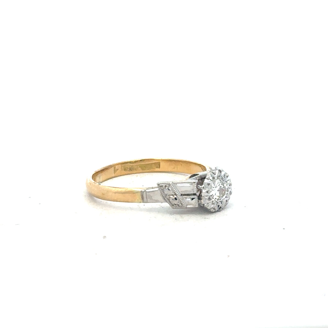 18ct yellow gold diamond ring in size L, featuring a sparkling diamond centerpiece and a sleek band design.