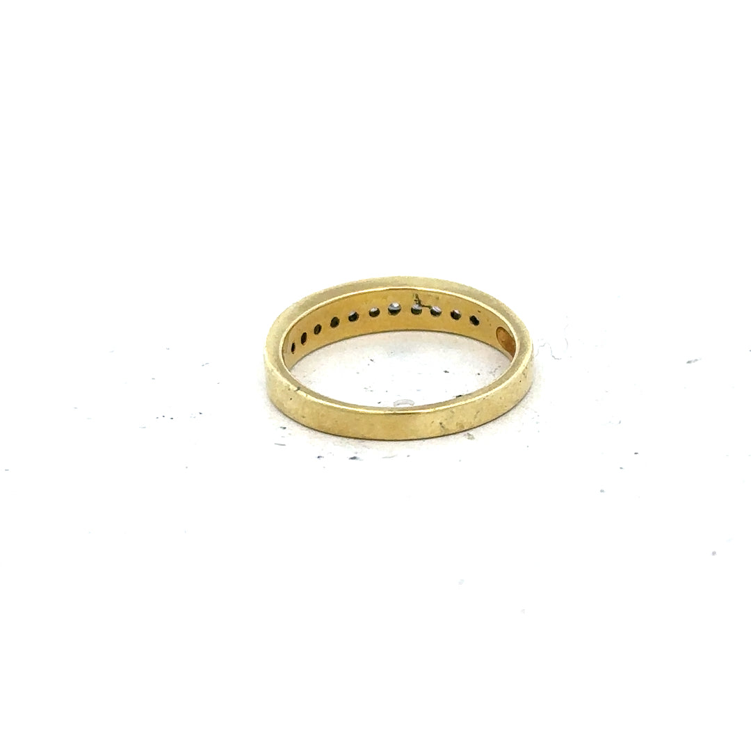 18ct yellow gold diamond ring in size L with sparkling diamonds, showcasing elegant jewelry design.