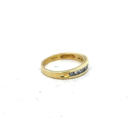 18ct yellow gold diamond ring in size L featuring a sparkling diamond, crafted with elegant and timeless design.