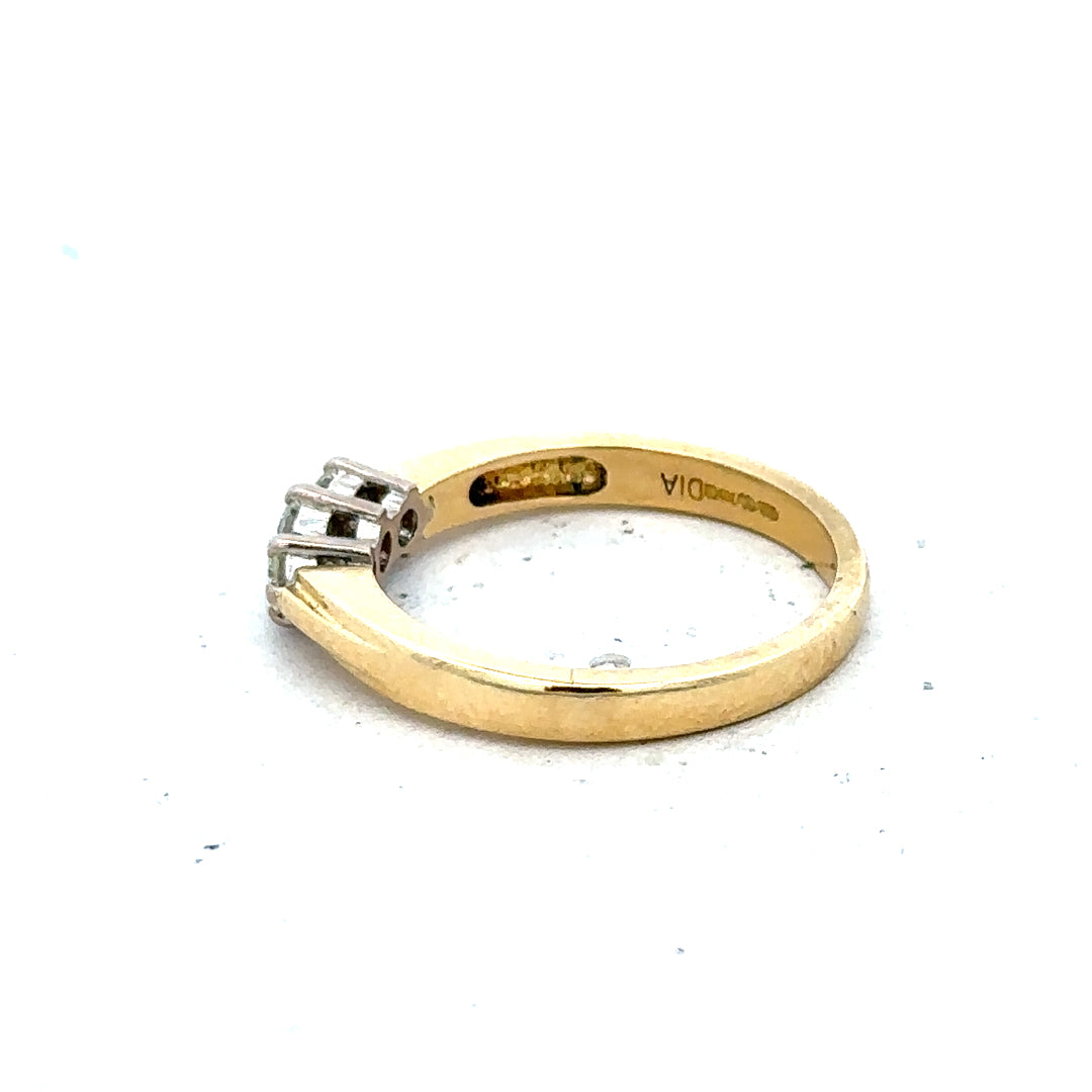 18ct yellow gold diamond ring in size L1/2, featuring sparkling diamonds on a simple band.
