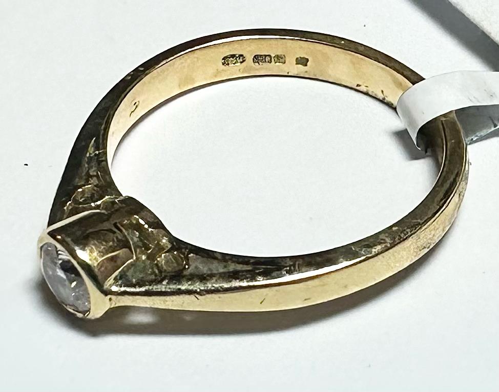 18ct yellow gold diamond ring in size L1/2, featuring sparkling diamonds and a sleek band design.