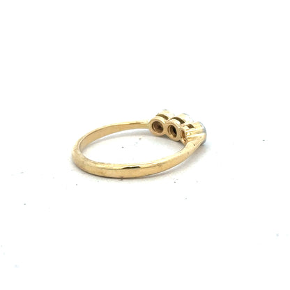 18ct yellow gold diamond ring in size O with sparkling diamonds, elegant jewelry piece with a polished finish.