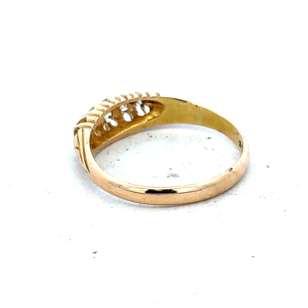 18ct yellow gold diamond ring in size P, unbranded, showing a detailed close-up of the gold band and sparkling diamonds.