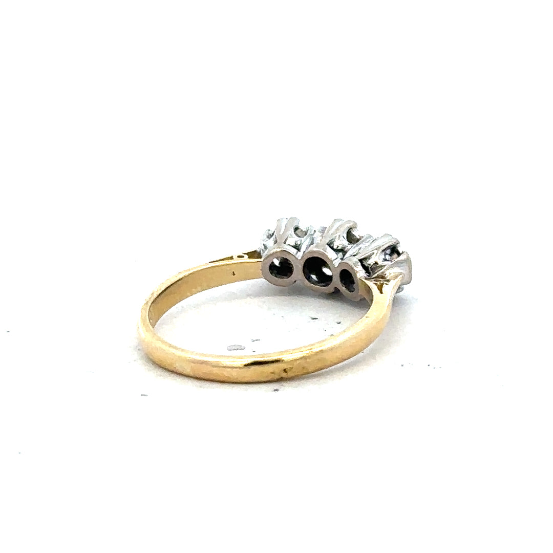 18ct yellow gold diamond ring in size P with sparkling diamonds, showcasing elegant craftsmanship and a classic design.