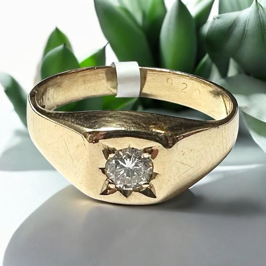 18ct yellow gold diamond ring in size S, featuring a sparkling diamond setting and a sleek band design.