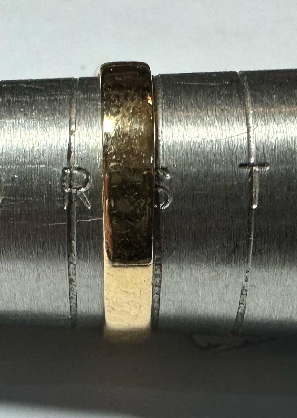 18ct yellow gold diamond ring size S, showcasing a delicate band with sparkling diamonds, unbranded jewelry accessory.