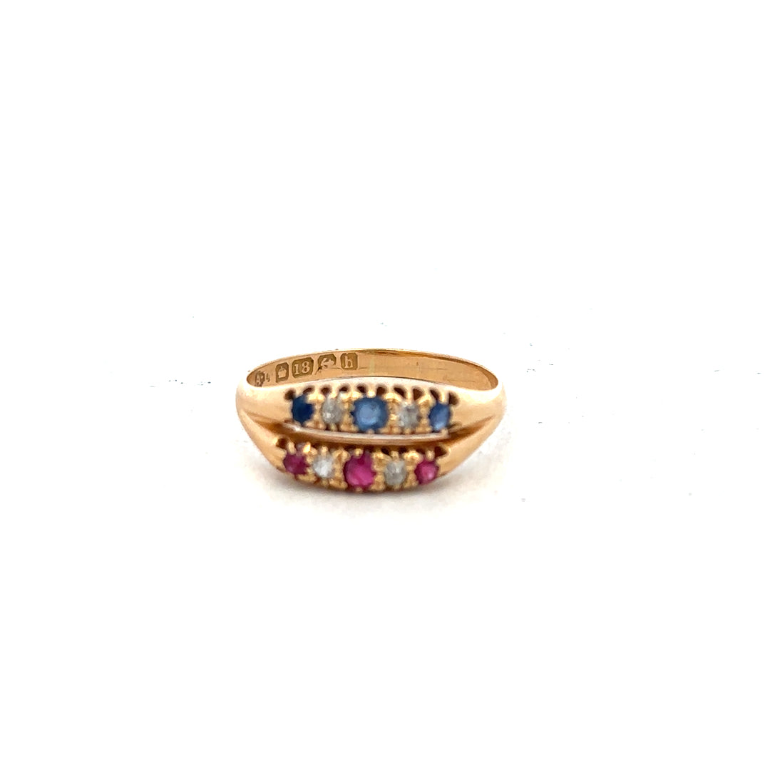 18ct yellow gold ring with diamonds, ruby, and sapphire, size P, showcasing colorful gemstones on a sleek band.
