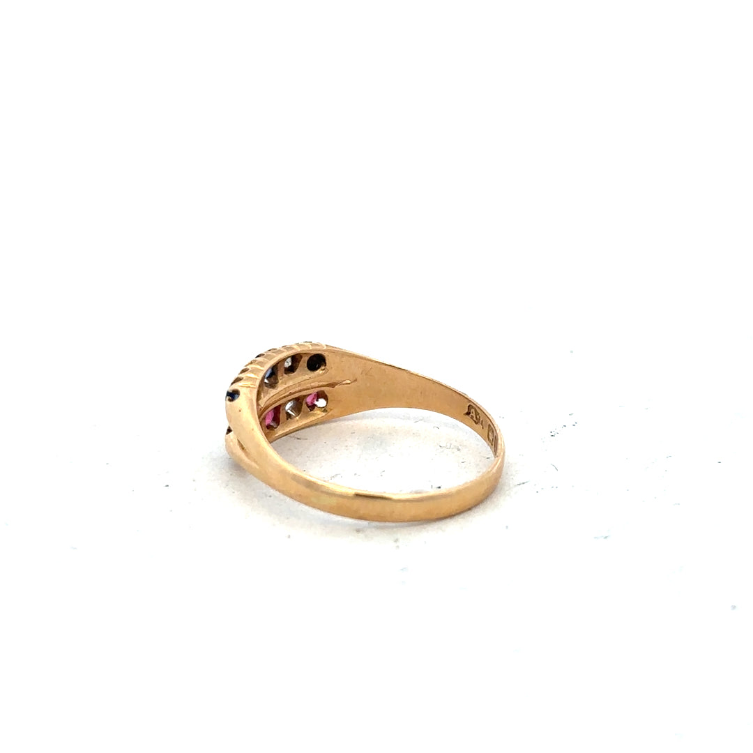 18ct yellow gold diamond, ruby, and sapphire ring in size P, featuring a detailed gemstone design.