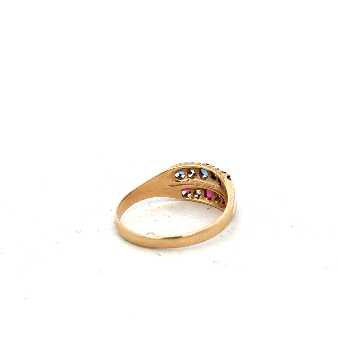 18ct yellow gold diamond, ruby, and sapphire ring in size P, featuring intricate gemstone settings and fine craftsmanship.