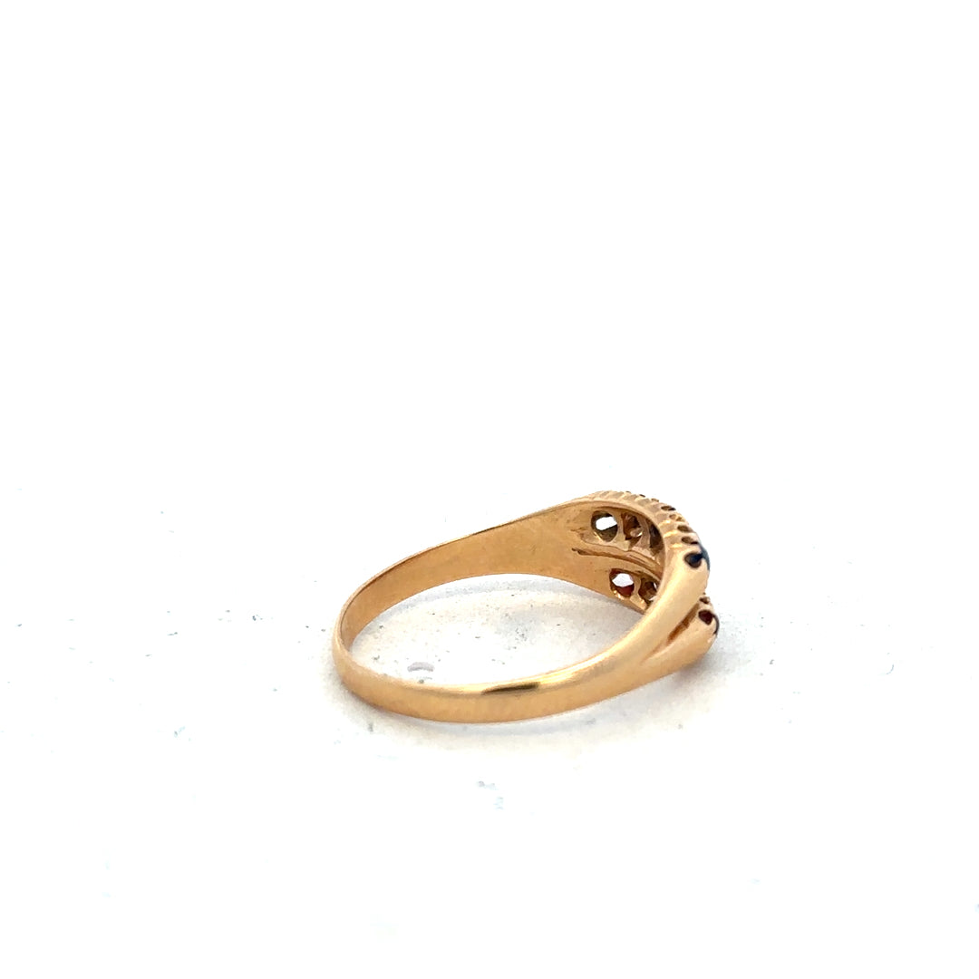 18ct yellow gold ring with diamonds, rubies, and sapphires in size P, featuring intricate gemstone detailing.