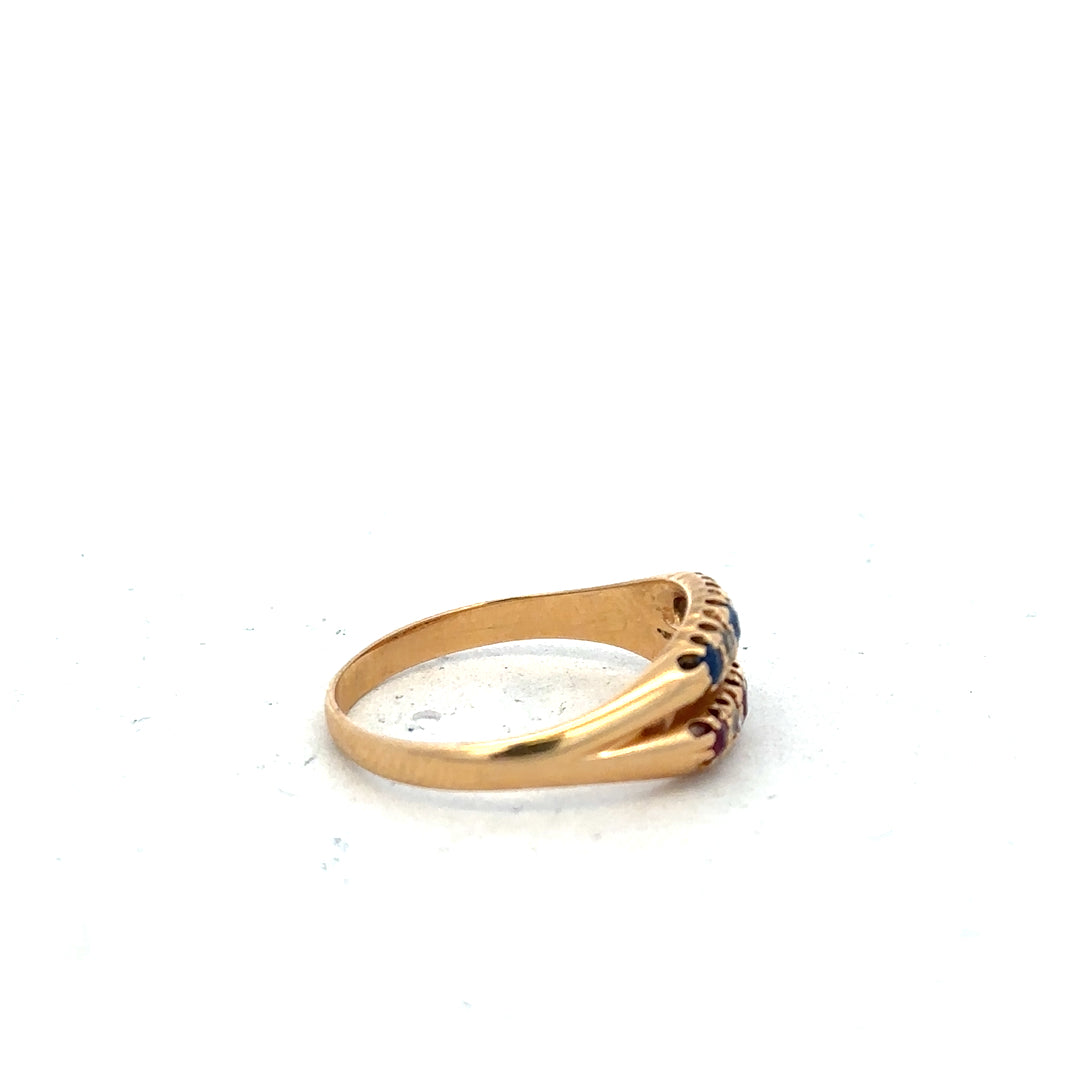 18ct yellow gold ring with diamonds, rubies, and sapphires in size P, featuring a detailed gemstone arrangement.