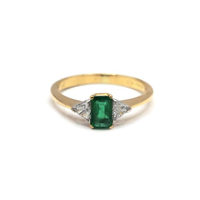 18ct yellow gold emerald and diamond ring with intricate design, featuring a central emerald surrounded by sparkling diamonds.