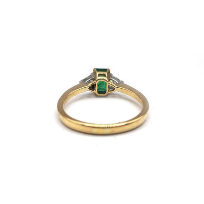 18ct yellow gold emerald and diamond ring with intricate design, showcasing vibrant green emeralds and sparkling diamonds.