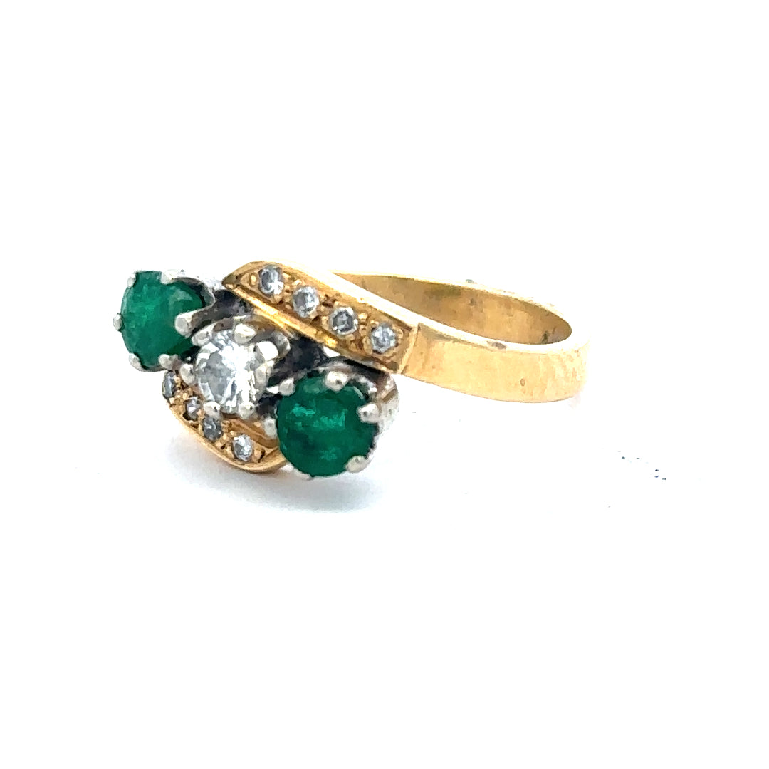 18ct yellow gold emerald and diamond ring, size N, showcasing a vibrant emerald centerpiece with sparkling diamonds.