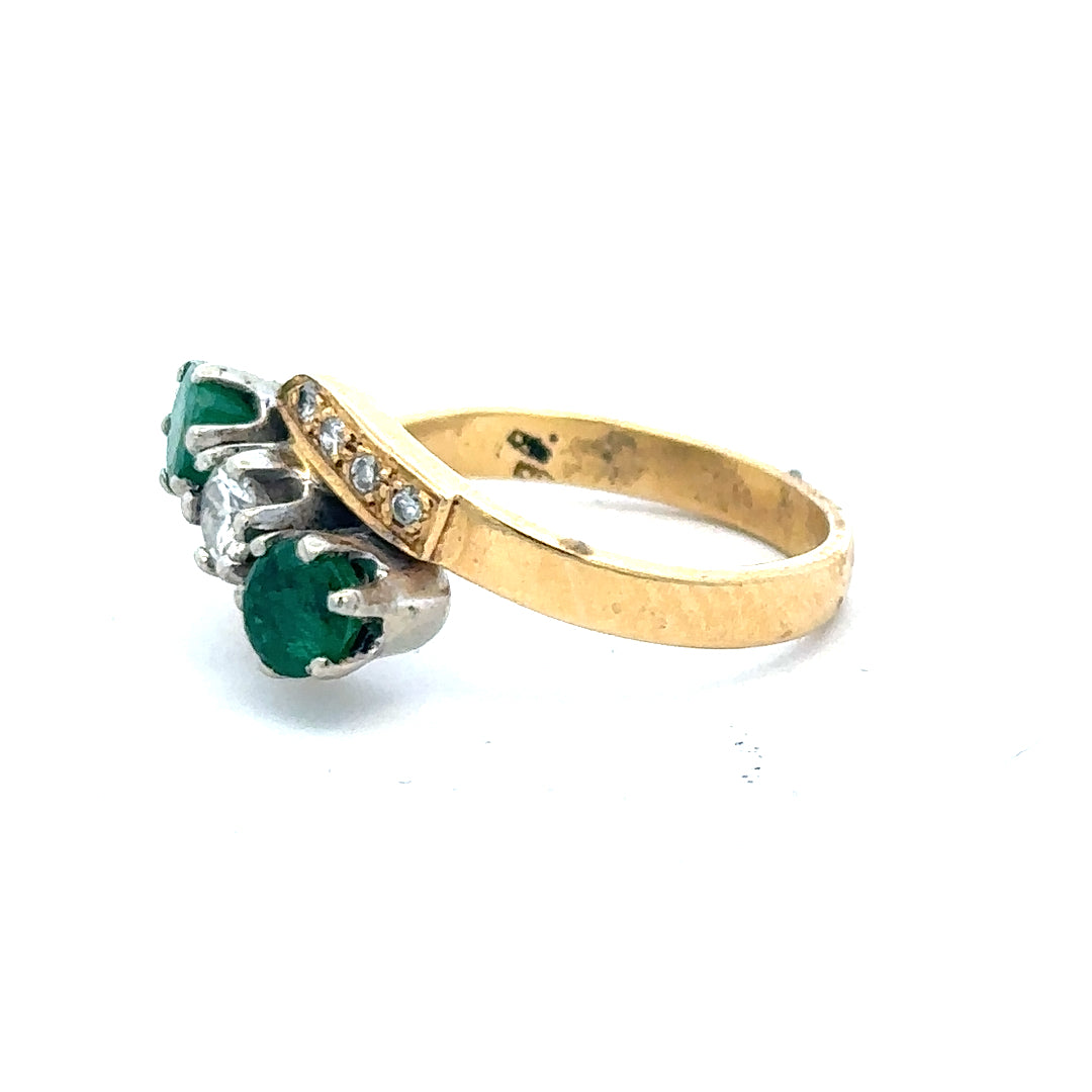 18ct yellow gold emerald and diamond ring in size N, featuring a detailed design with sparkling gemstones.