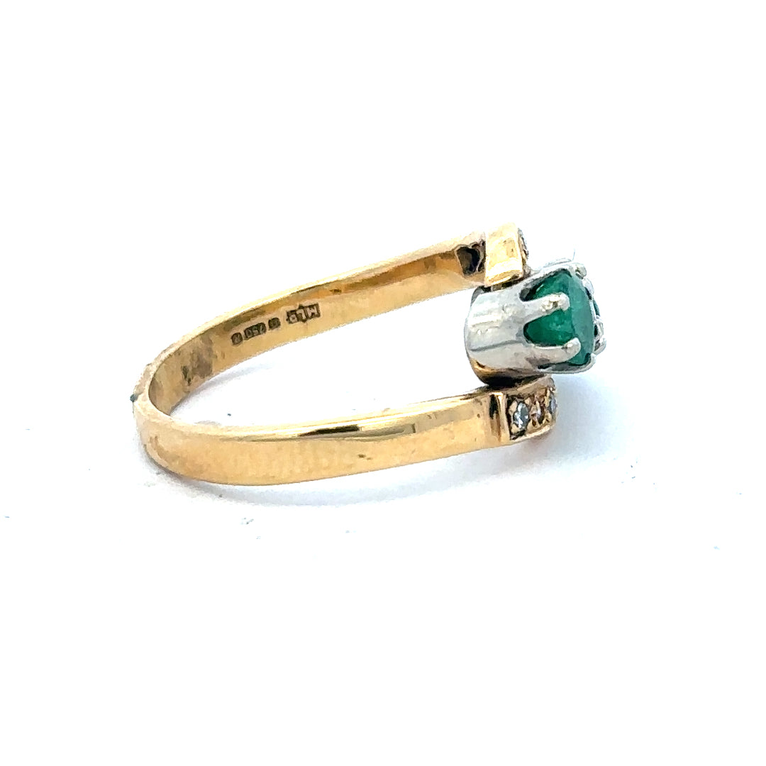 18ct yellow gold emerald and diamond ring, size N, featuring a central emerald gemstone surrounded by sparkling diamonds.