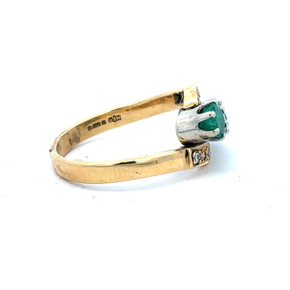 18ct yellow gold emerald and diamond ring, size N, featuring a central emerald gemstone surrounded by sparkling diamonds.
