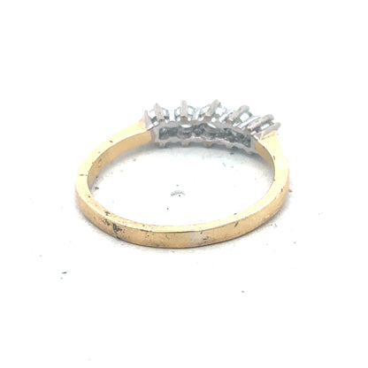 18ct yellow gold five-stone diamond ring with 1/2 carat total weight, showcasing five sparkling diamonds on an elegant band.
