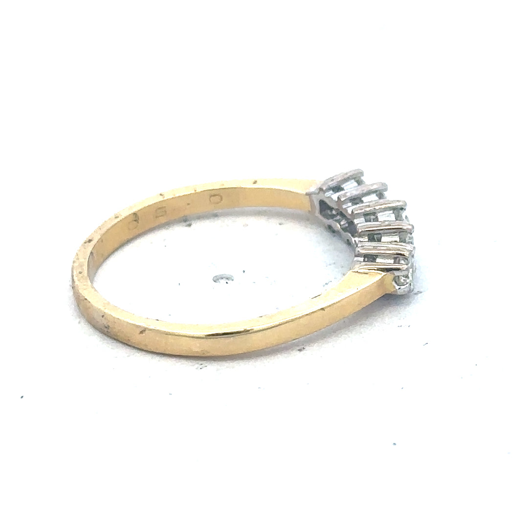 18ct yellow gold five-stone diamond ring with 1/2 carat total weight, featuring sparkling diamonds on a sleek band.