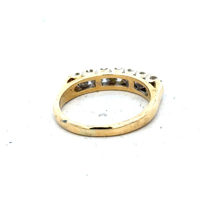 18ct yellow gold half eternity diamond ring with alternating small diamonds around the band, elegant jewelry accessory.