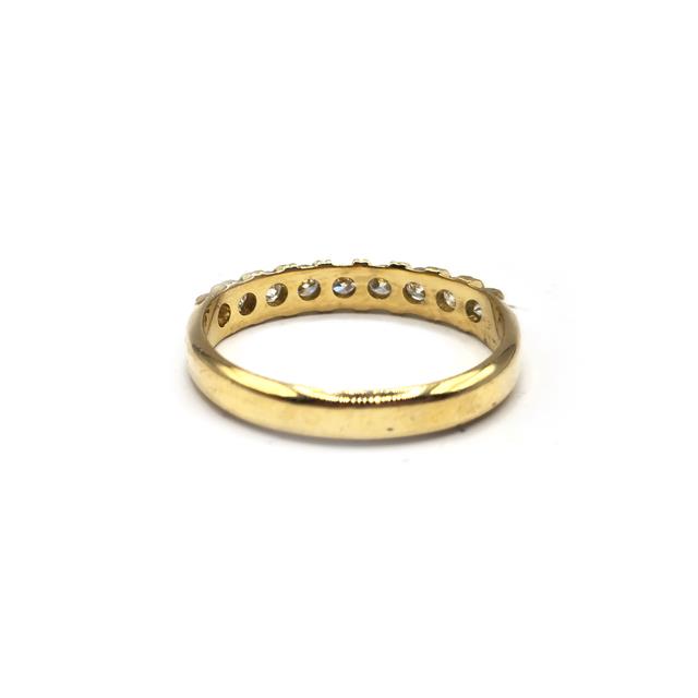 18ct yellow gold half eternity diamond ring featuring a row of sparkling diamonds, elegant and timeless jewelry piece.