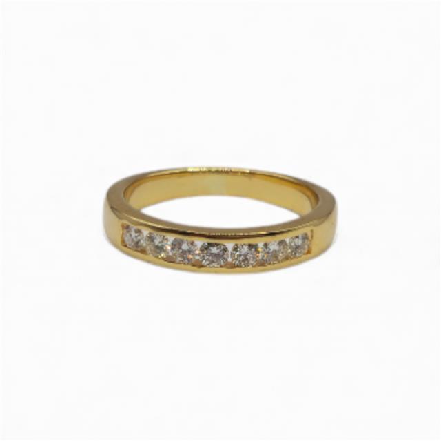 18ct yellow gold half eternity diamond ring with sparkling diamonds, showcasing a luxurious and elegant jewelry piece.
