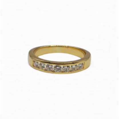 18ct yellow gold half eternity diamond ring with sparkling diamonds, showcasing a luxurious and elegant jewelry piece.
