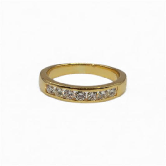 18ct yellow gold half eternity diamond ring with sparkling diamonds, showcasing a luxurious and elegant jewelry piece.