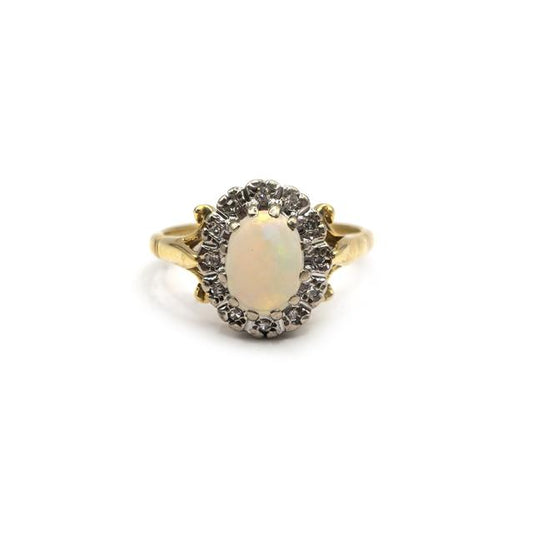 18ct yellow gold opal and diamond ring featuring a vibrant opal center and sparkling diamonds, crafted in unbranded jewelry style.
