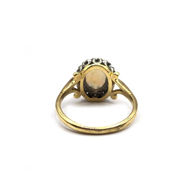 18ct yellow gold opal and diamond ring featuring a vibrant opal centerpiece with diamond accents, crafted in elegant gold.