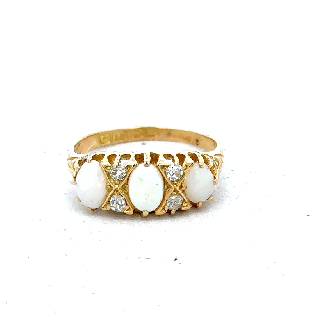 18ct yellow gold opal and diamond ring in size M, featuring a vibrant opal centerpiece and sparkling diamonds.