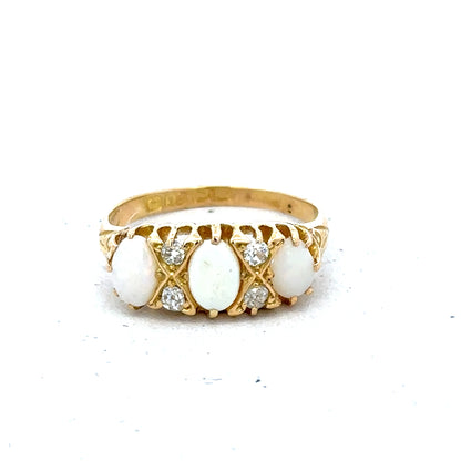 18ct yellow gold opal and diamond ring in size M, featuring a vibrant opal centerpiece and sparkling diamonds.