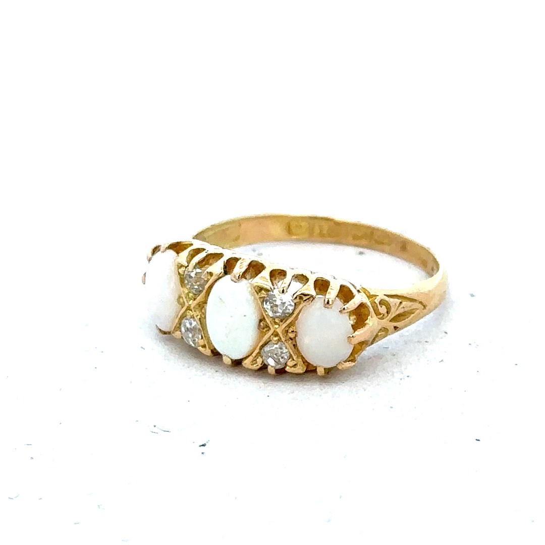 18ct yellow gold opal and diamond ring in size M, featuring a vibrant opal centerpiece and sparkling diamonds.