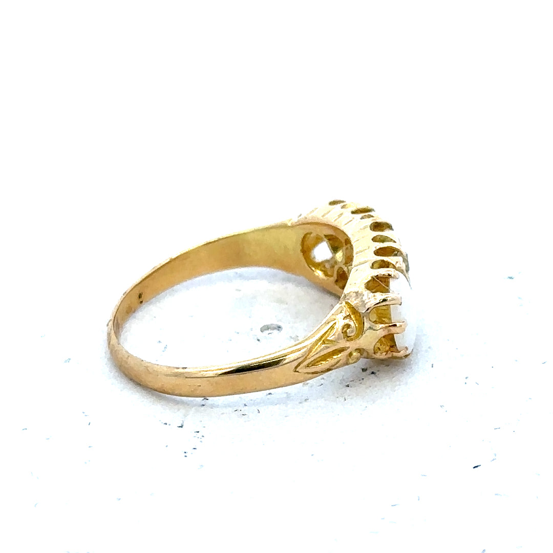 18ct yellow gold opal and diamond ring in size M, featuring a vibrant opal center stone with sparkling diamonds.