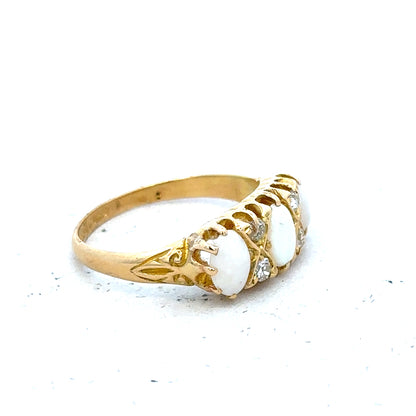 18ct yellow gold opal and diamond ring in size M, showcasing a vibrant opal center with sparkling diamonds on a gold band.