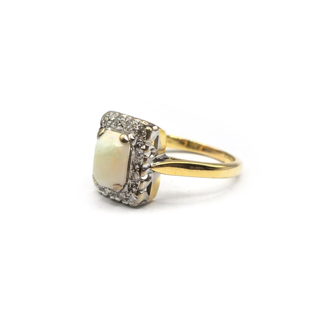 18ct yellow gold opal and diamond ring in size N1/2, featuring a vibrant opal centerpiece and sparkling diamonds.
