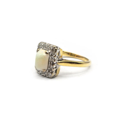 18ct yellow gold opal and diamond ring in size N1/2, featuring a vibrant opal centerpiece and sparkling diamonds.
