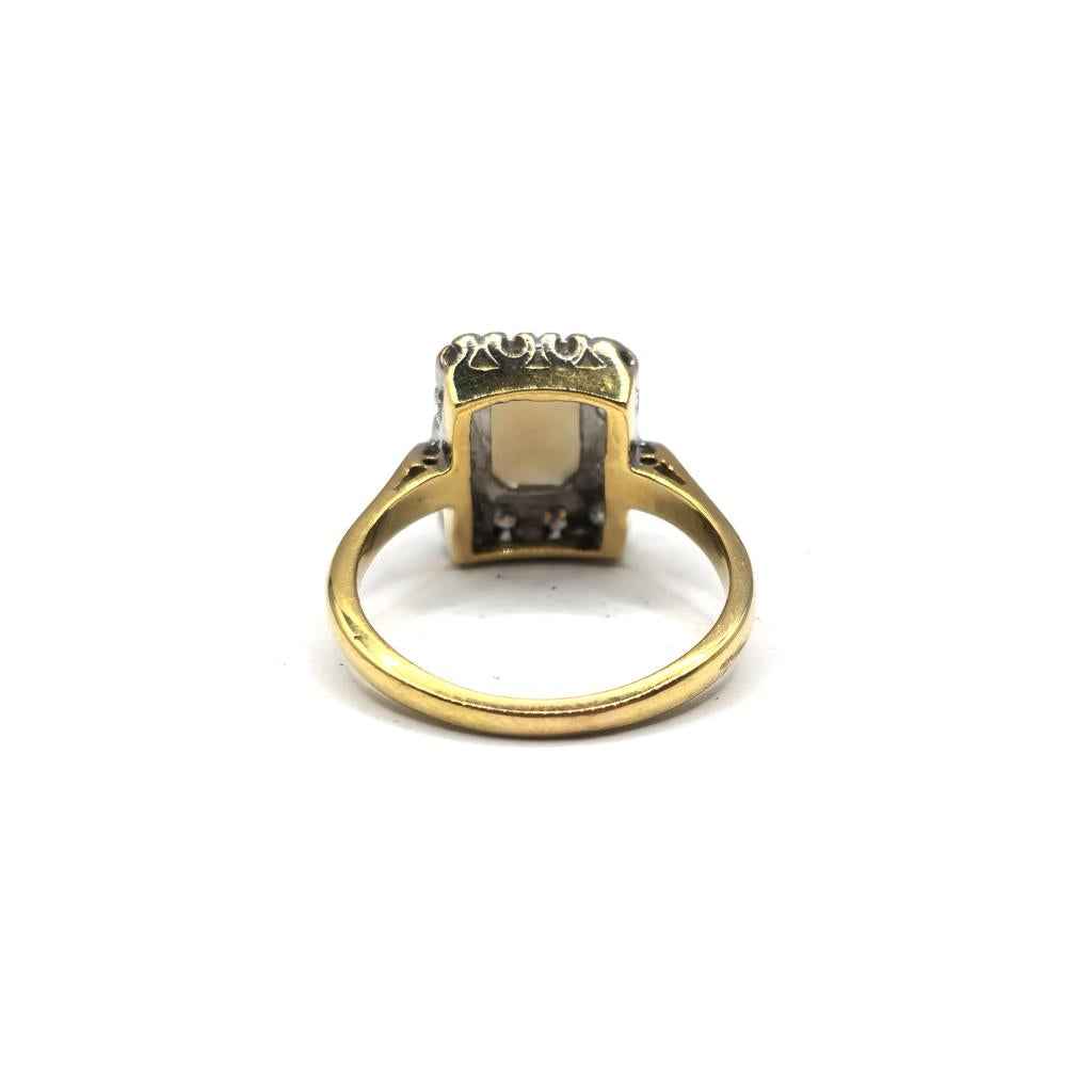 18ct yellow gold opal and diamond ring in size N1/2, featuring a vibrant opal gemstone and sparkling diamonds.