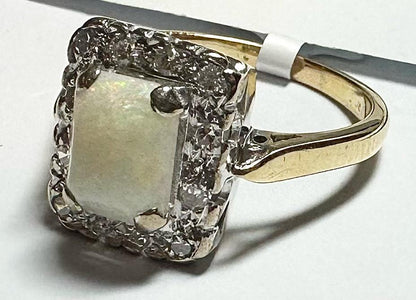18ct yellow gold opal and diamond ring in size N1/2, featuring a vibrant opal gemstone and sparkling diamonds.
