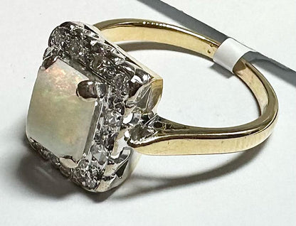 18ct yellow gold opal and diamond ring in size N1/2, featuring a vibrant opal gemstone and sparkling diamonds.