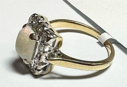 18ct yellow gold opal and diamond ring, size N1/2, featuring a vibrant opal gemstone and sparkling diamond accents.