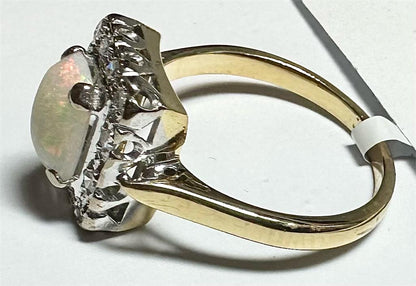 18ct yellow gold opal and diamond ring, size N1/2, featuring a vibrant opal gemstone and sparkling diamonds.