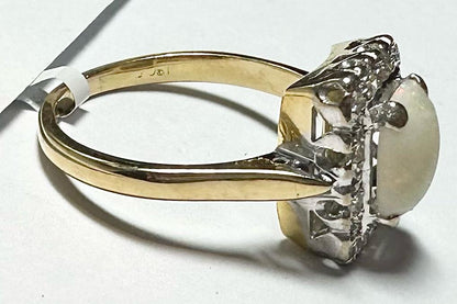 18ct yellow gold opal and diamond ring with size N1/2, featuring vibrant opal and sparkling diamonds on a polished band.