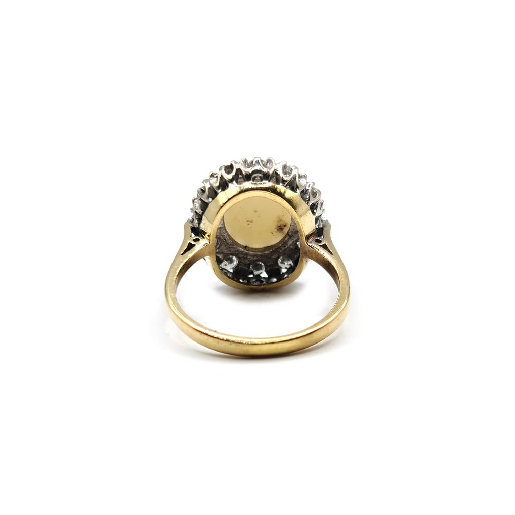18ct yellow gold oval ring with 1.85 carat opal and 0.60 carat diamond accents, showcasing elegant jewelry design.