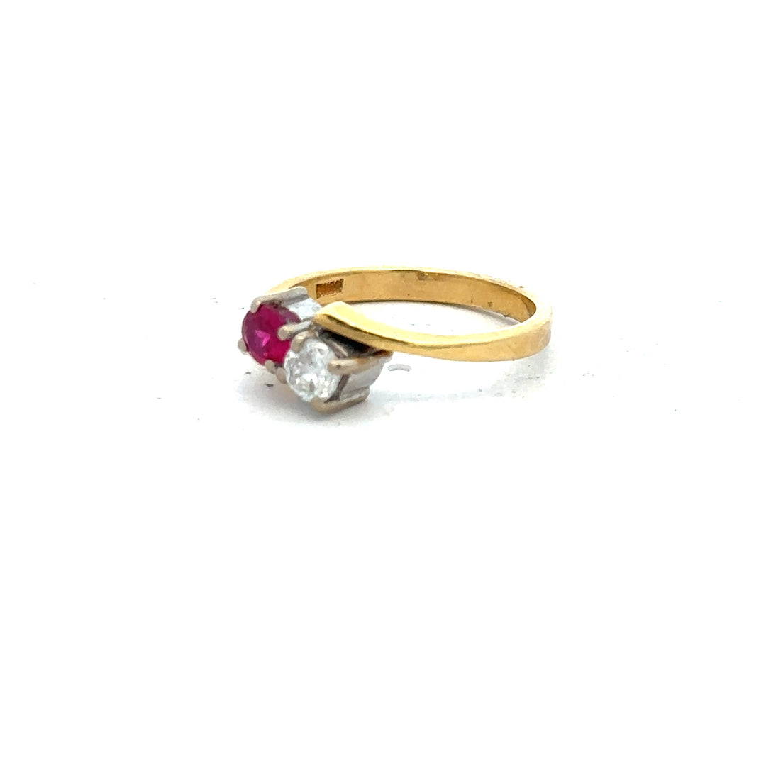 18ct yellow gold ruby and diamond ring in size L, featuring a vibrant ruby centerpiece with sparkling diamonds.