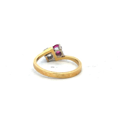 18ct yellow gold ruby and diamond ring in size L, featuring a vibrant ruby center surrounded by sparkling diamonds.