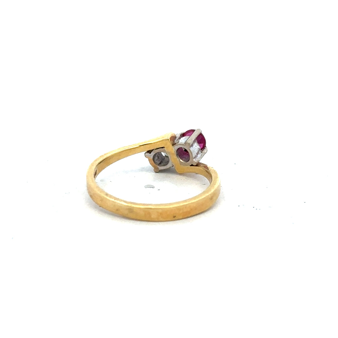 18ct yellow gold ruby and diamond ring in size L, featuring a vibrant ruby center and sparkling diamonds.