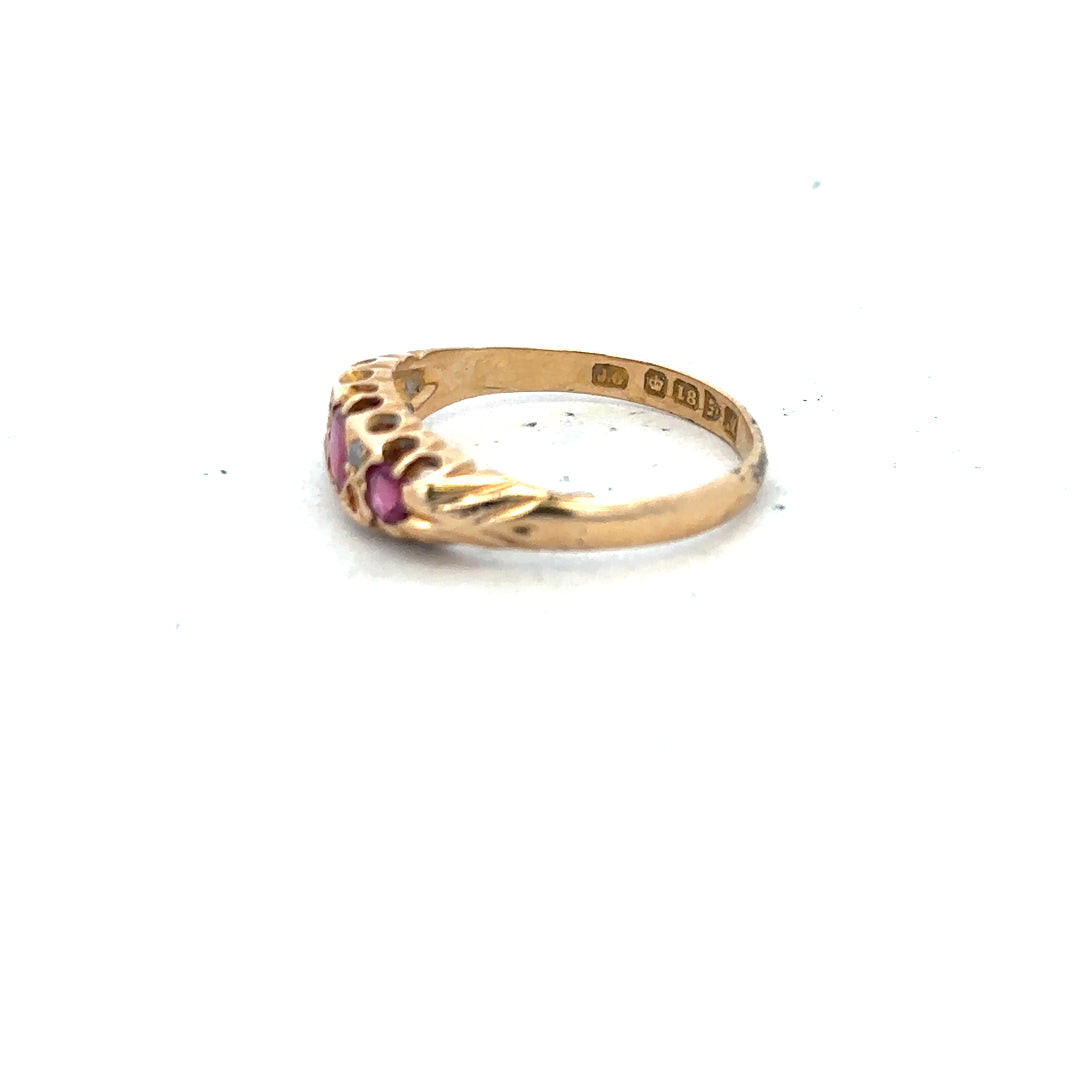 18ct yellow gold ruby and diamond ring in size P, featuring a vibrant ruby center with sparkling diamonds on the band.